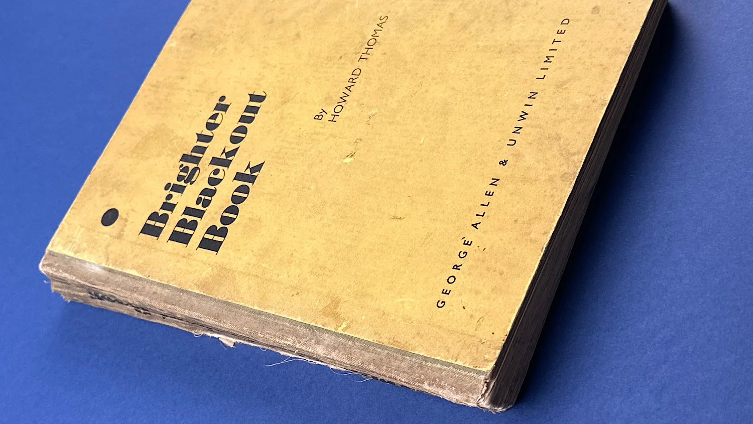 WW2 Brighter Blackout Book (1939–1940) by Howard Thomas, original wartime edition with cloth strip spine and printed boards front cover and spine