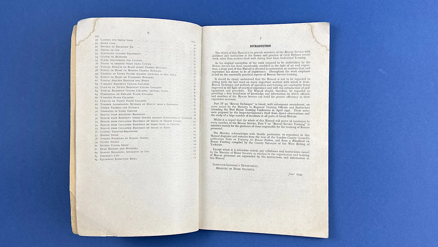 Open pages of the WW2 ARP Rescue Service Manual showing the List of Illustrations and Introduction section with corner staining.