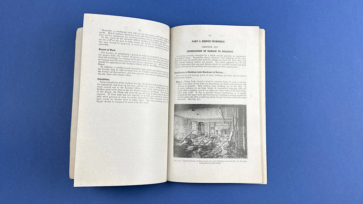 Open pages of the WW2 ARP Rescue Service Manual featuring text on building damage and an illustration of blast effects inside a framed building.