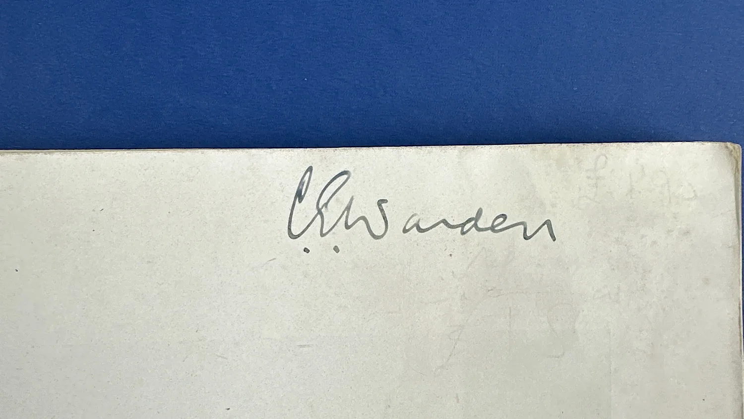 Close-up of handwritten name inside Bureaucrats in Battledress, located on the front endpaper