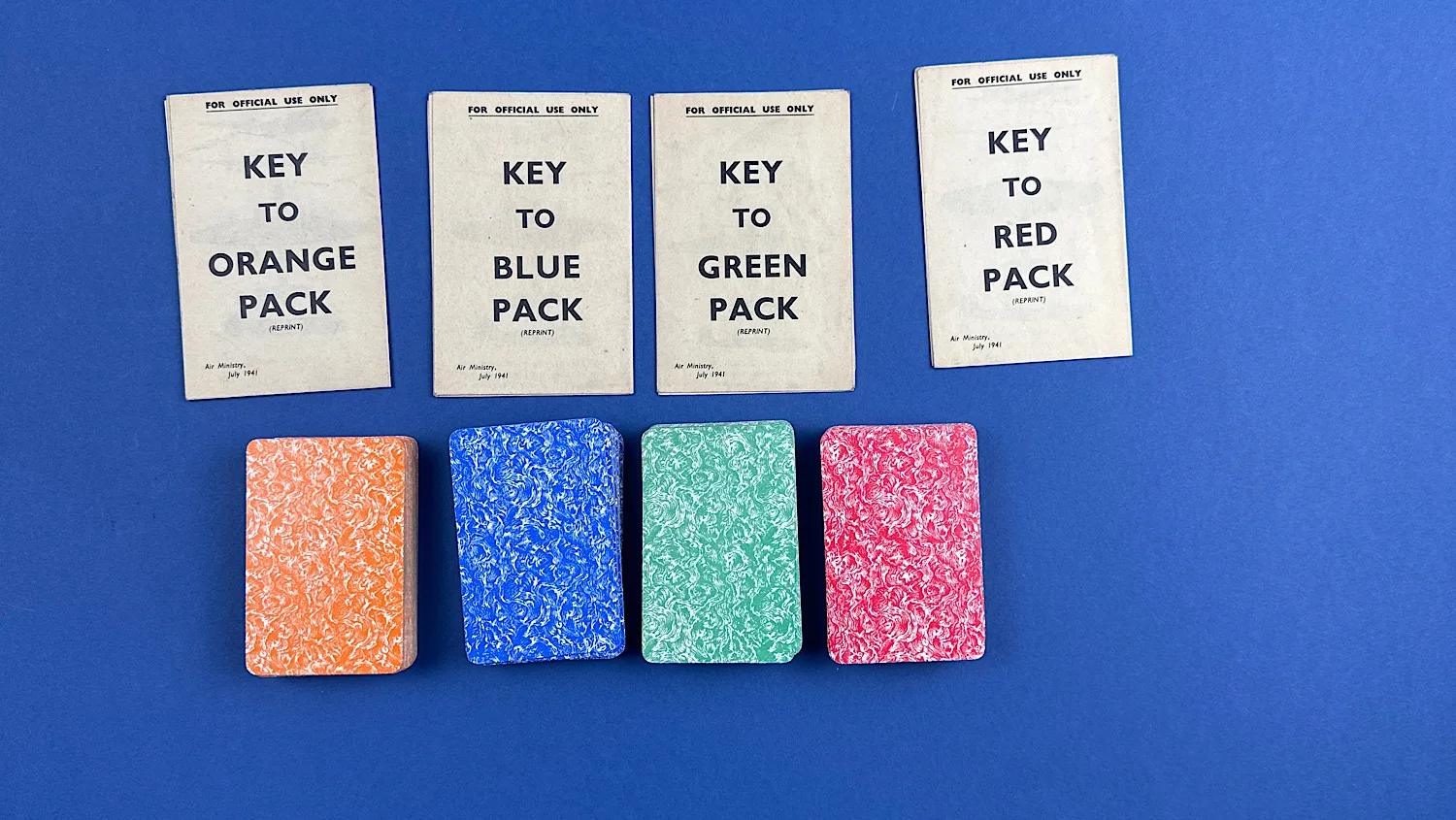 Four coloured WW2 aircraft recognition decks with their matching key sheets for Orange, Blue, Green and Red packs