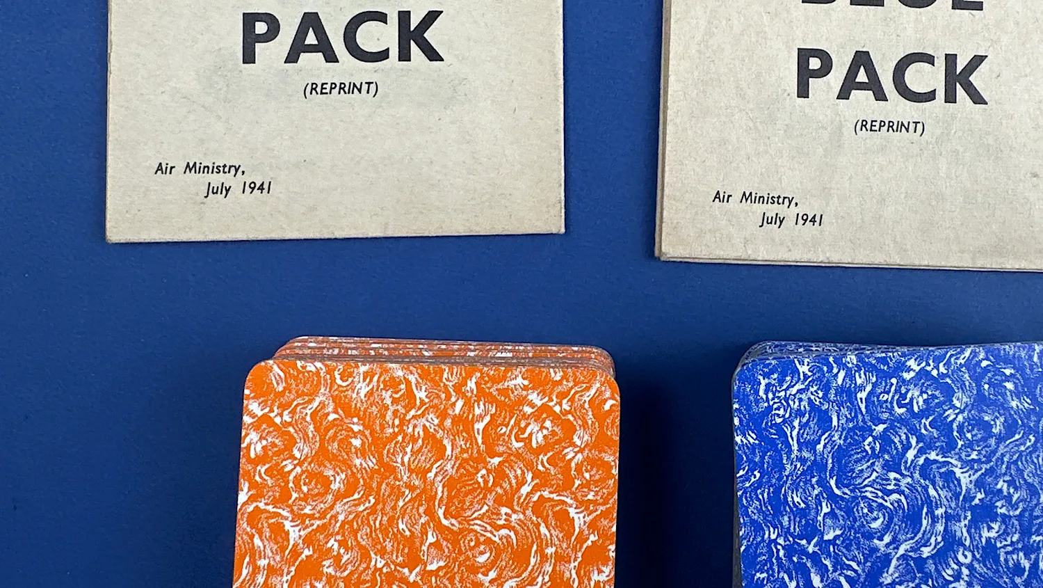 Close-up of WW2 Aircraft Recognition Key to Orange Pack and Blue Pack sheets above their matching card decks showing July 1941 date