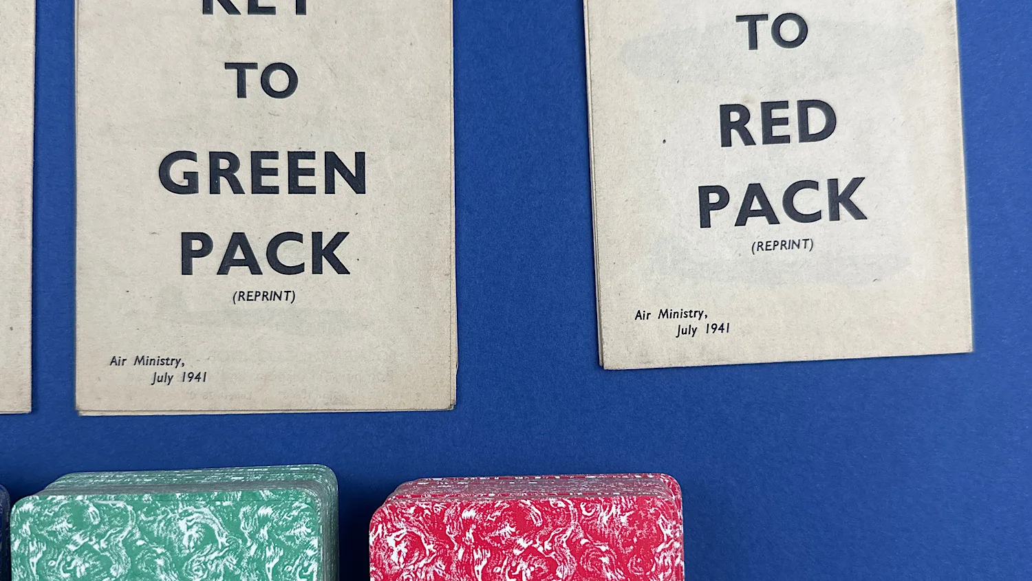 Close-up of the Key to Green Pack and Key to Red Pack sheets showing the July 1941 Air Ministry reprint date with the green and red card decks beneath
