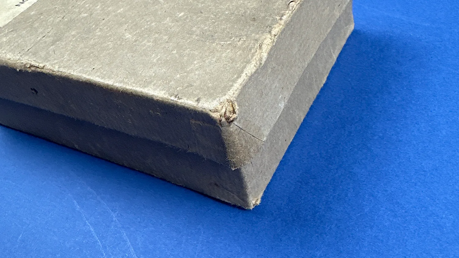 Close-up of a worn corner on the Aircraft Recognition Silhouette Cards box showing age-related fraying