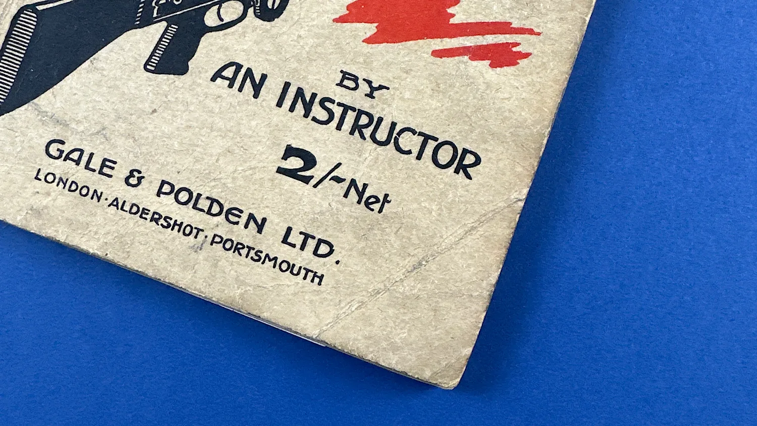 Close-up of lower front cover showing Gale and Polden imprint and corner fold