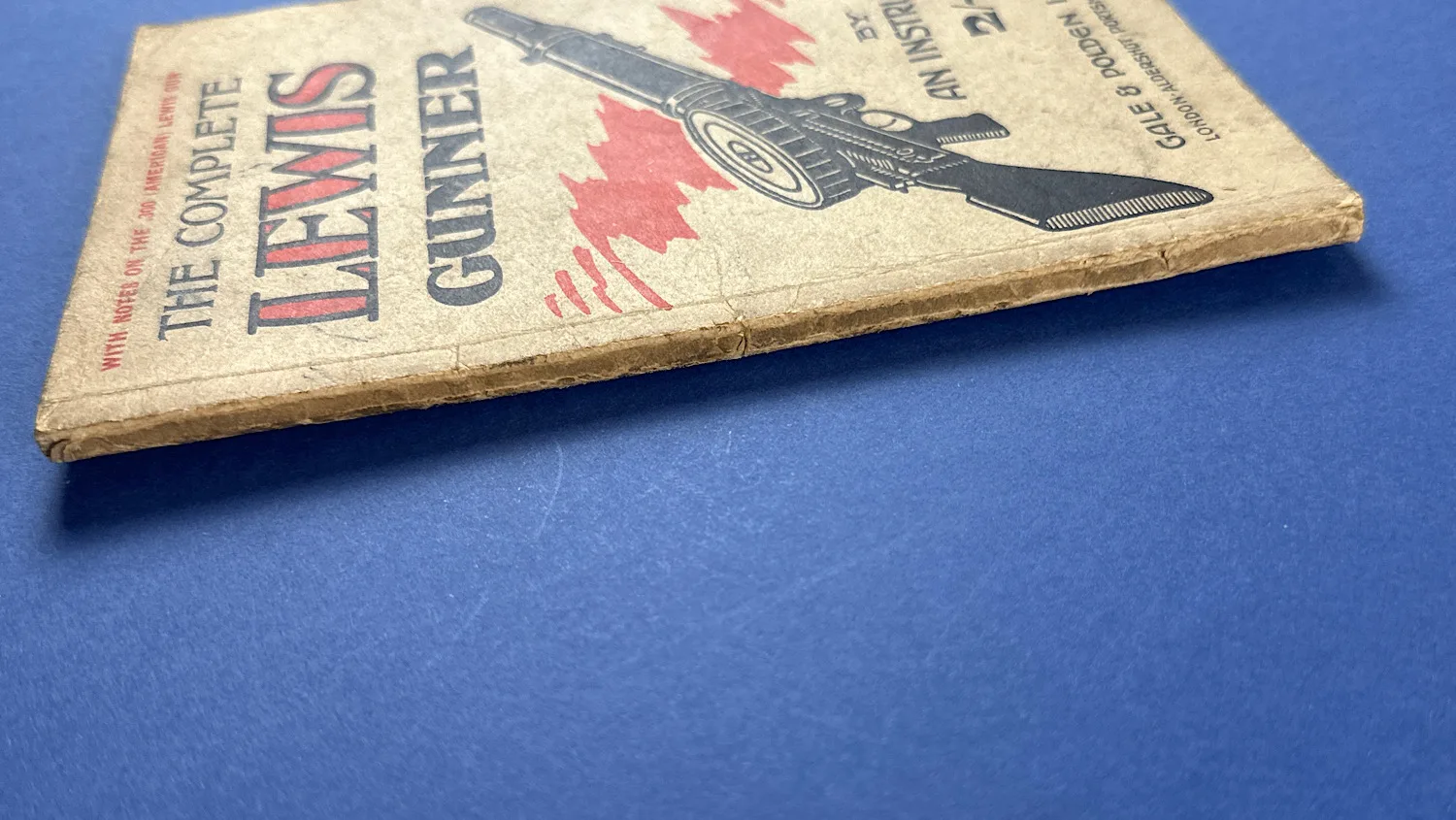 Spine view of The Complete Lewis Gunner booklet showing age wear