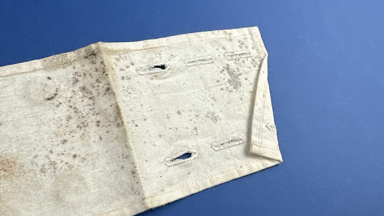 Detail view of adjustable buttonholes on WW2 US medical armband