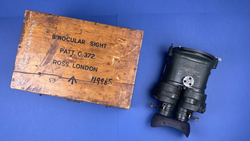 WW2 British binocular gunsight Pattern C372 by Ross London shown alongside original wooden transit case