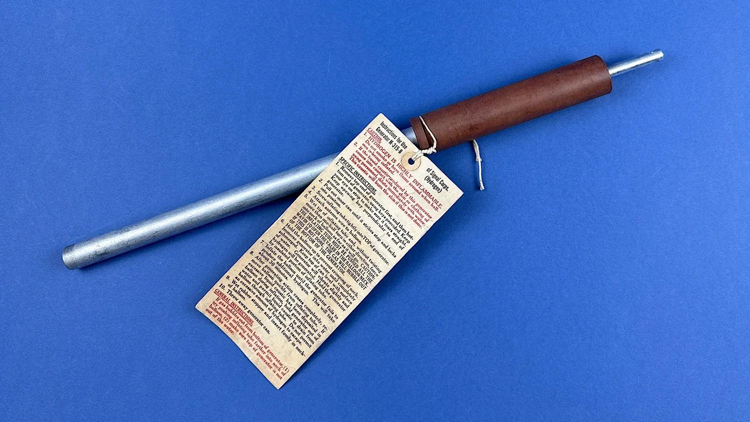 Original WWII U.S. Army Signal Corps M-315-B hydrogen balloon inflating tube with original instruction tag attached