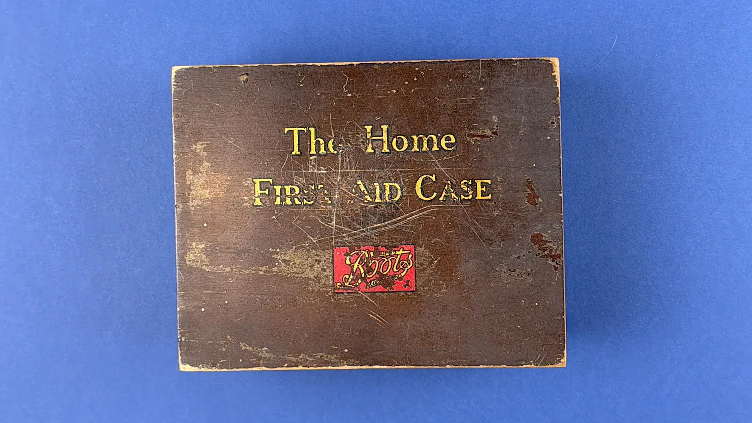 British Home Front Boots “Home” First Aid Case wooden box exterior showing original printed title and aged finish