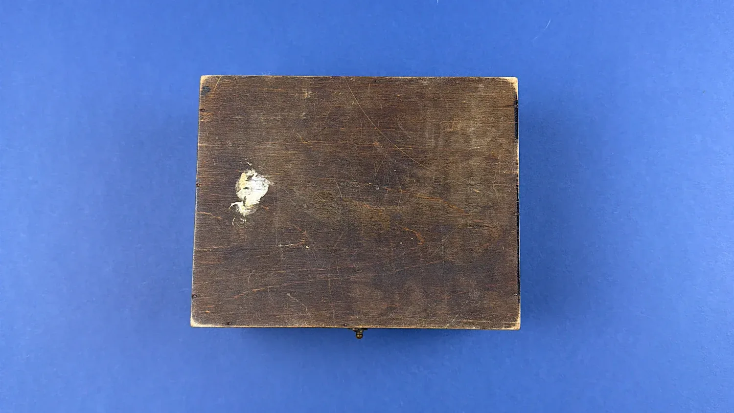 British Home Front Boots “Home” First Aid Case base view showing original wood panel and period wear