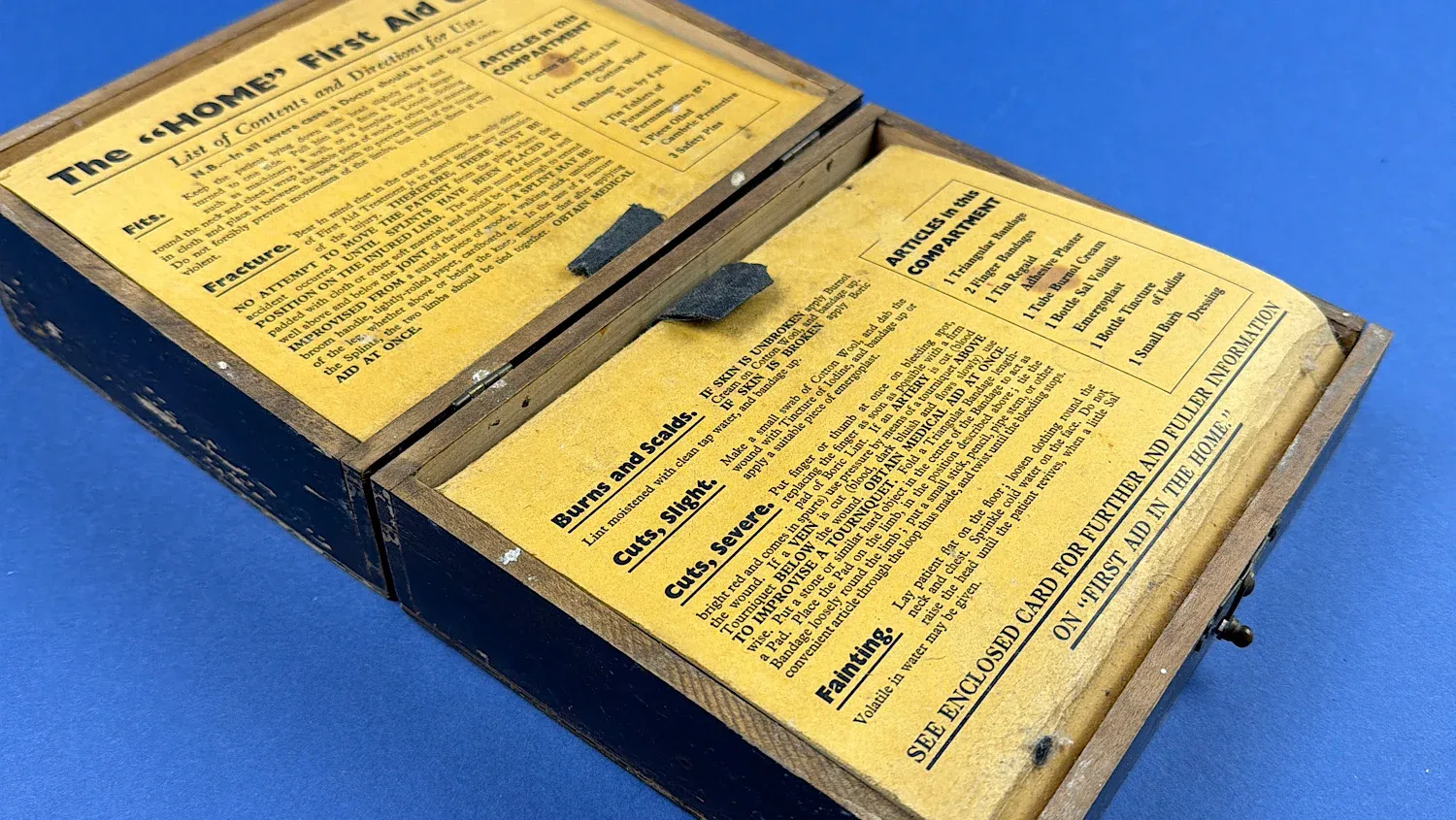 British Home Front Boots “Home” First Aid Case angled interior view highlighting period medical instructions and compartment layout