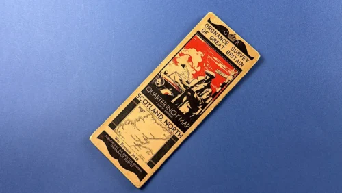 Angled view of WW2 Ordnance Survey Scotland North quarter inch map cover showing illustrated artwork title panel and War Revision 1940 marking