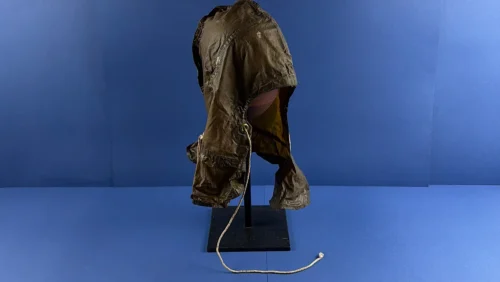 WW2 British ARP anti gas protective hood displayed on stand showing full Home Front Civil Defence form with draw cord and skirted lower section