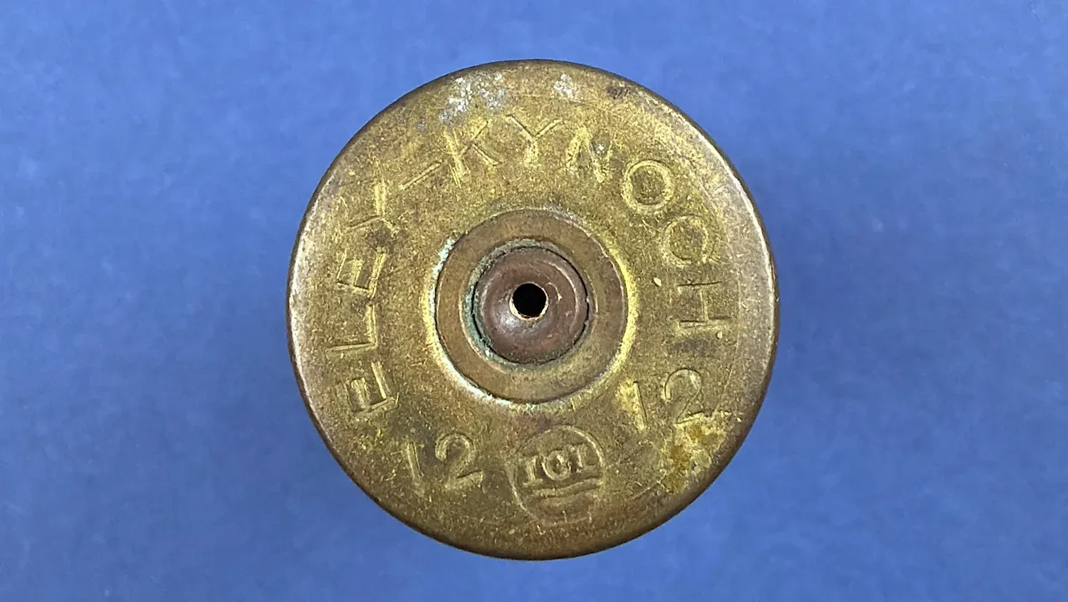 Brass head showing Eley Kynoch 12 12 headstamp and drilled primer on WW2 British 12 Bore solid ball cartridge