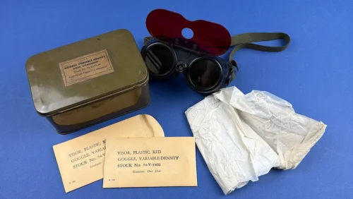 WW2 US Army 1944 Variable Density Goggles set with American Optical tin red Polaroid tracer visor envelopes and instruction sheet laid out together