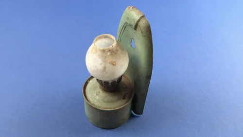 WW2 era British wall mounted paraffin lamp with green painted metal reflector plate and opal glass shade