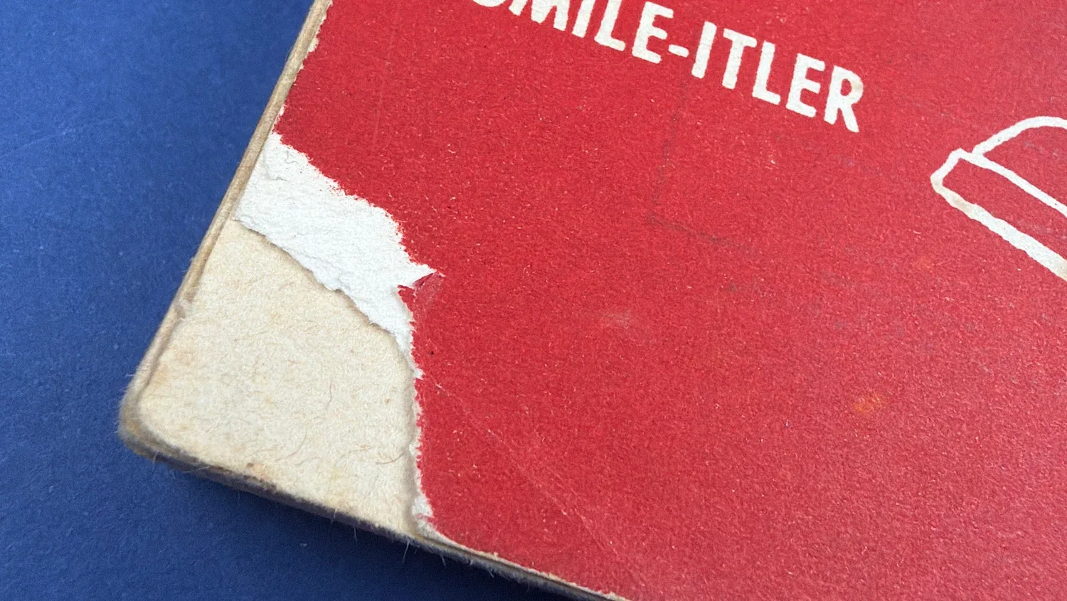 Close up of rear cover edge showing paper loss and wear to corner of WW2 Mein Rampf satirical booklet Home Front ephemera