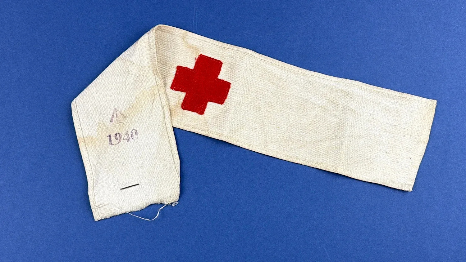 WW2 British Red Cross armband dated 1940 with Broad Arrow marking visible