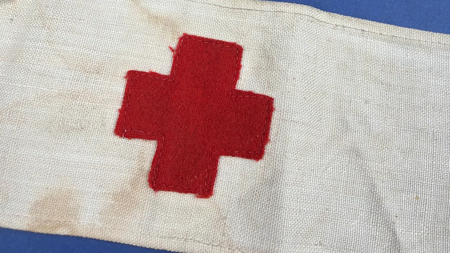 Detail of stitched red cross on WW2 British Red Cross Home Front armband