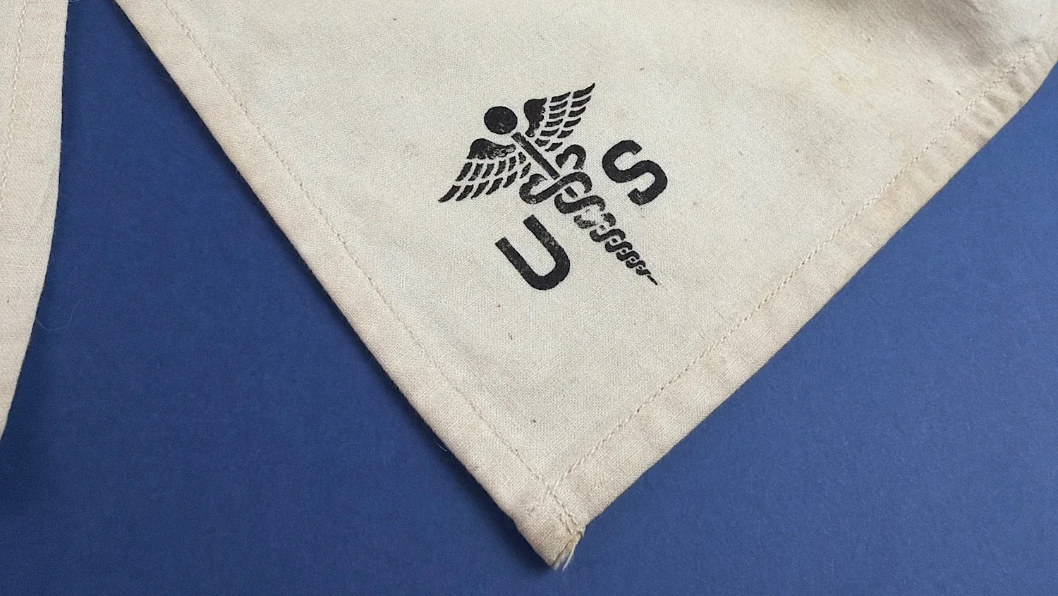 WW2 US Medical Corps caduceus marked corner detail with clear U.S. stencil marking