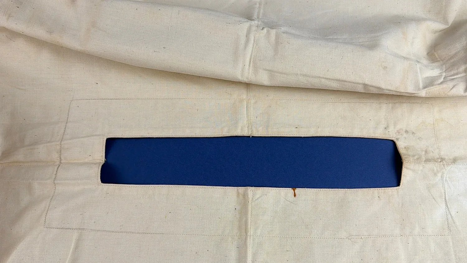 WW2 US Army surgical drape central aperture detail showing reinforced operating opening