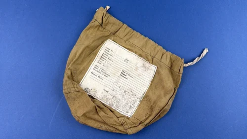 WW2 US Army personal effects bag with printed casualty identification panel visible