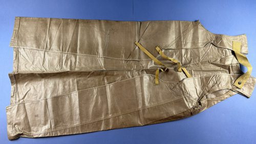 Rear view of original WW2 U.S. Chemical Warfare Service Impermeable Protective Apron M1 showing straps and neck fastening
