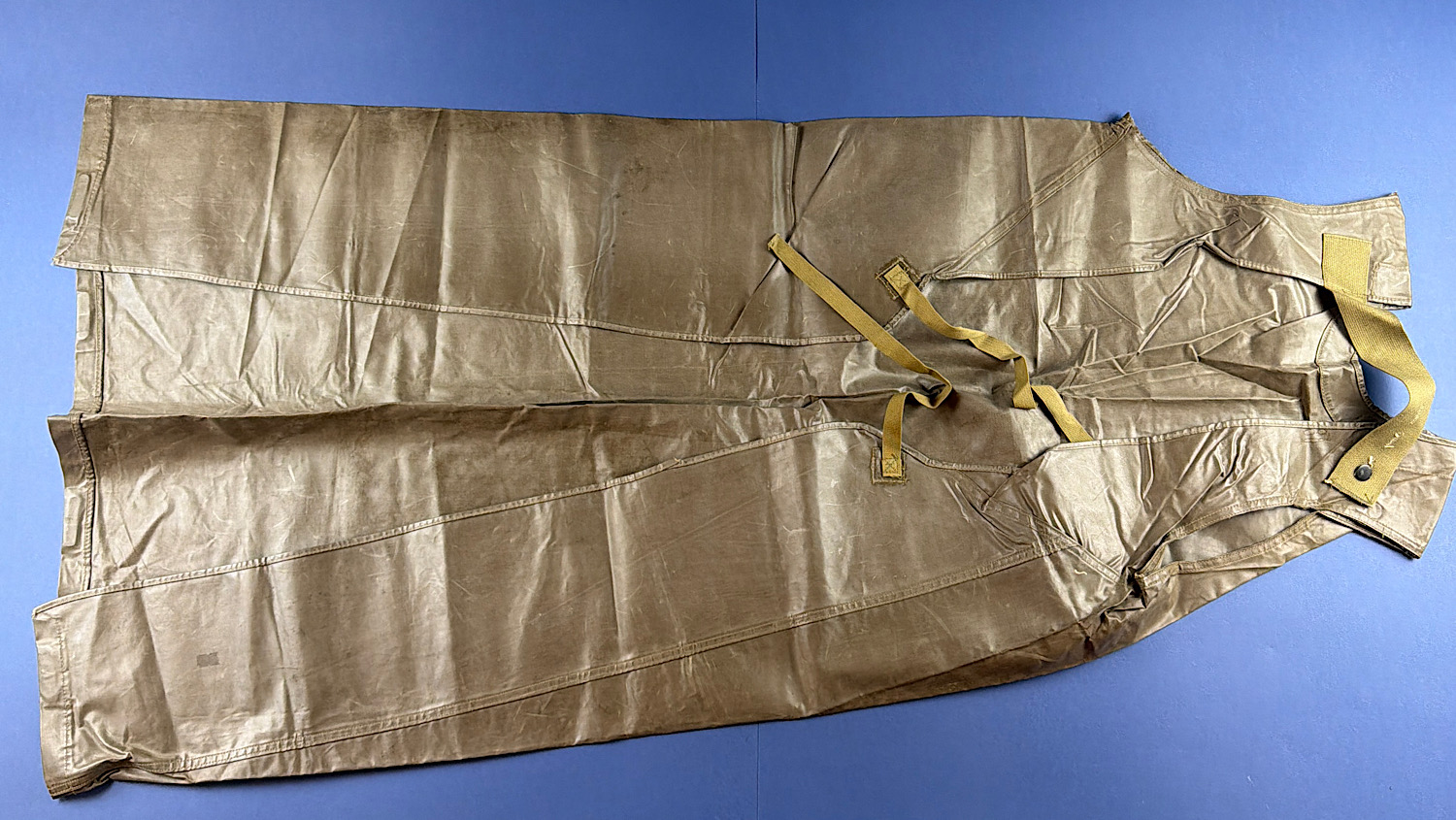Rear view of original WW2 U.S. Chemical Warfare Service Impermeable Protective Apron M1 showing straps and neck fastening