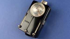 Angled view of vintage Narva multi-colour signal lamp showing front lens and controls