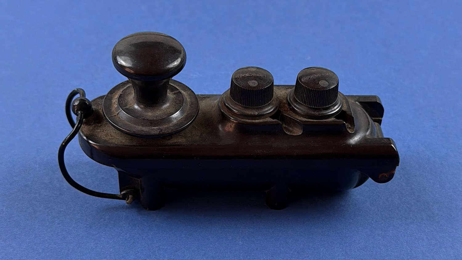 WW2 RAF aircraft Morse key with rounded black casing and twin adjustment knobs