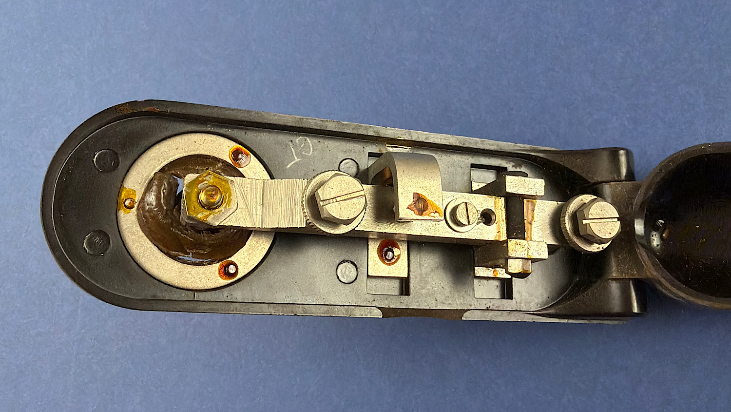 Open internal view of the WW2 RAF Bathtub Morse key showing the contact arm and fittings