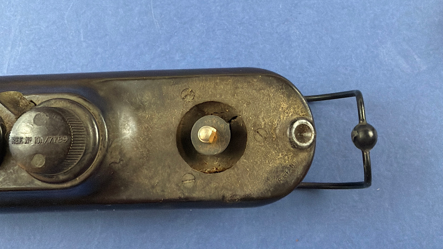 Underside view of the RAF Bathtub Morse key showing the wire loop and base fittings