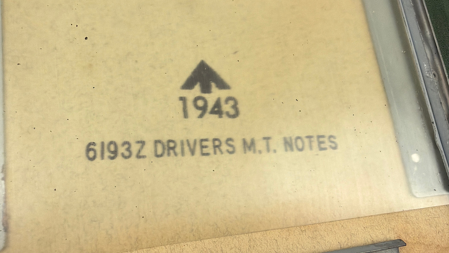 Close up of 1943 date and broad arrow mark on British Drivers M.T. Notes sleeve