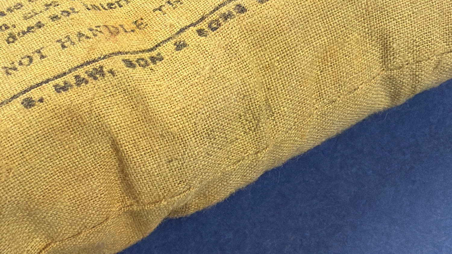 WW2 British First Field Dressing showing faint July 1944 date stamp on original unopened wrapper