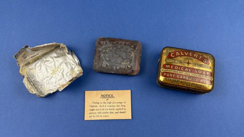Calvert's Medical Soap tin, original soap bar, foil wrapper and instruction notice displayed separately