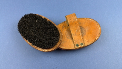 WW1 U.S. Army horse grooming brush pair with leather backs and original hand straps