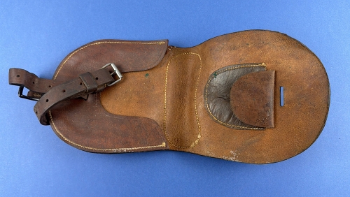 Leather horseshoe wallet opened to show the interior compartments and retaining pocket.