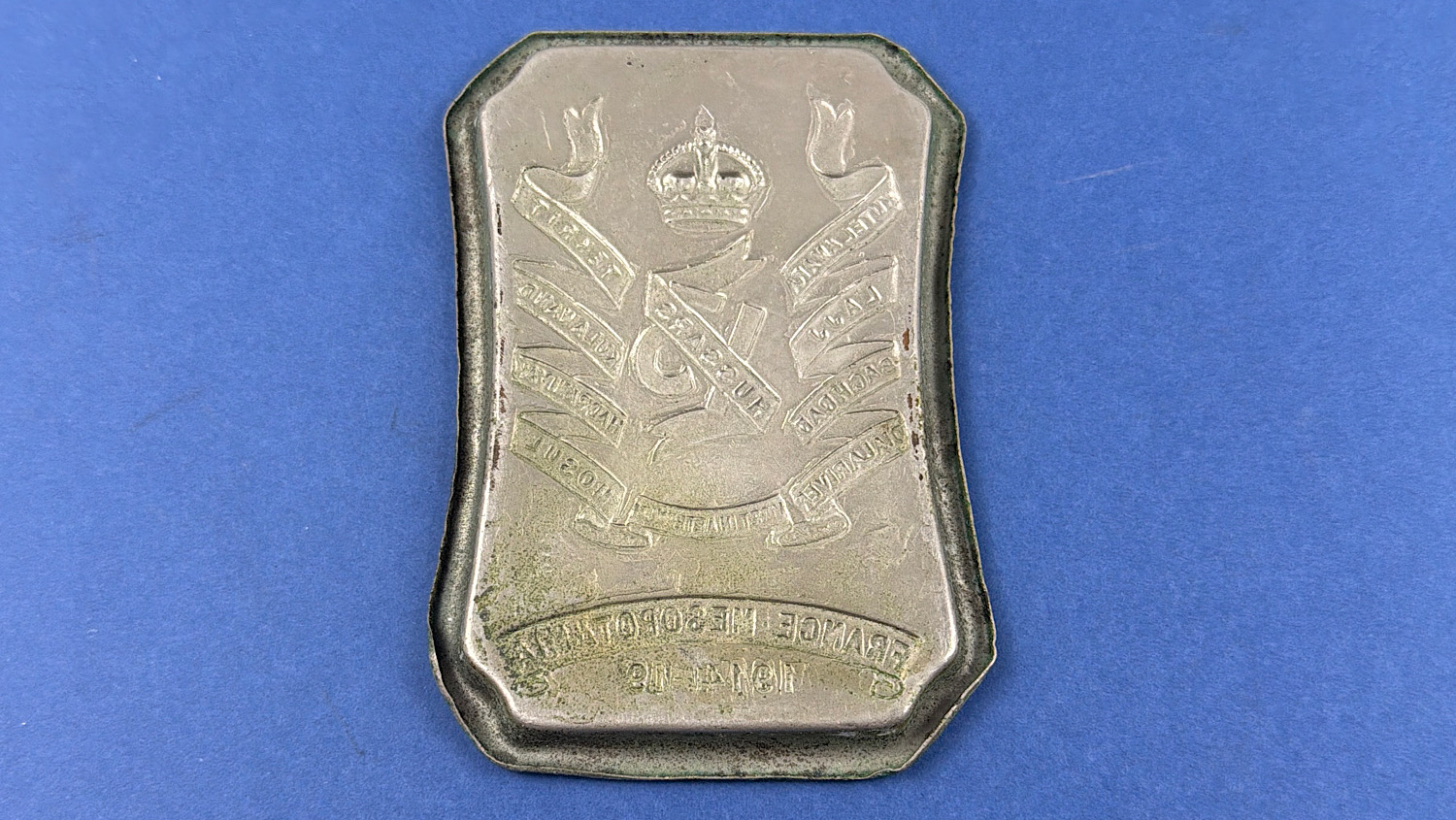 Reverse of the original WW1 13th Hussars commemorative tray showing the embossed regimental design.