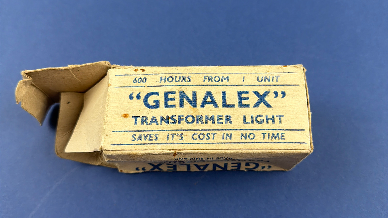Side view of the original WW2 Genalex transformer light box highlighting the 600-hour service life claim and original wartime branding.