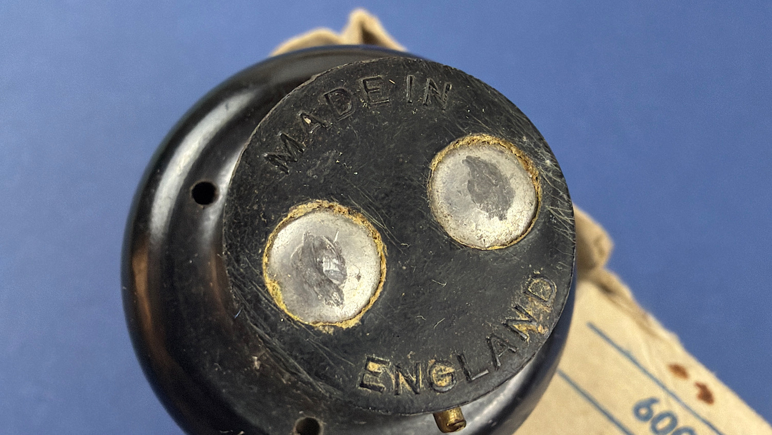 Close-up of the original two-pin plug on the WW2 Genalex transformer light, moulded "Made in England".