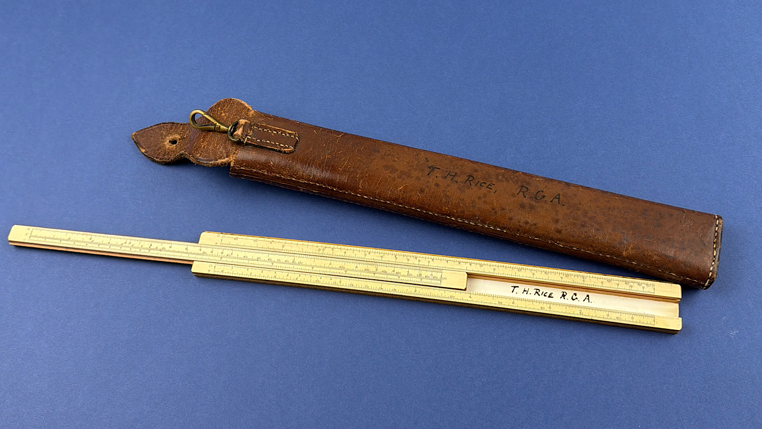 Original WW1 Royal Garrison Artillery named boxwood slide rule with 1916 dated broad arrow leather case.