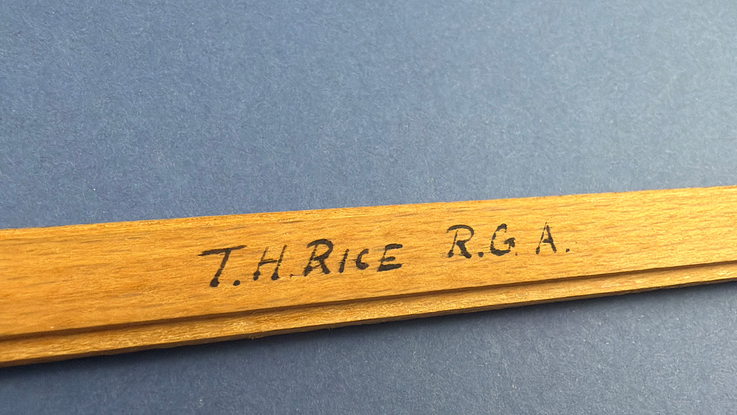Close-up of the T.H. Rice R.G.A. ownership inscription on the original WW1 boxwood slide rule.