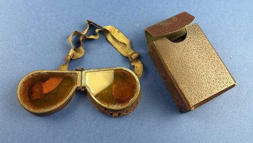 Original WW2 British military vehicle goggles with amber-tinted lenses and original brown storage case.