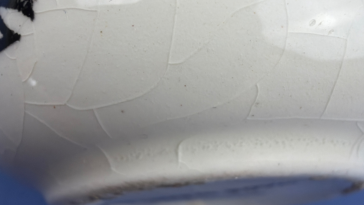 Close-up of the crazing to the glaze on the WW2 Fieldings anti-Hitler chamber pot ashtray.